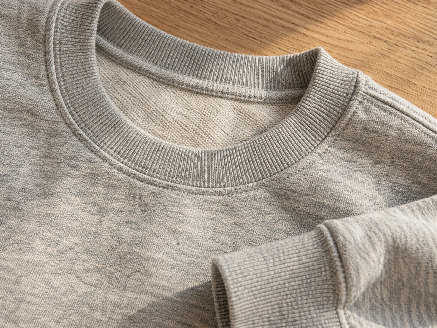 Close-up of a knitted sweatshirt collar and ribbed cuff